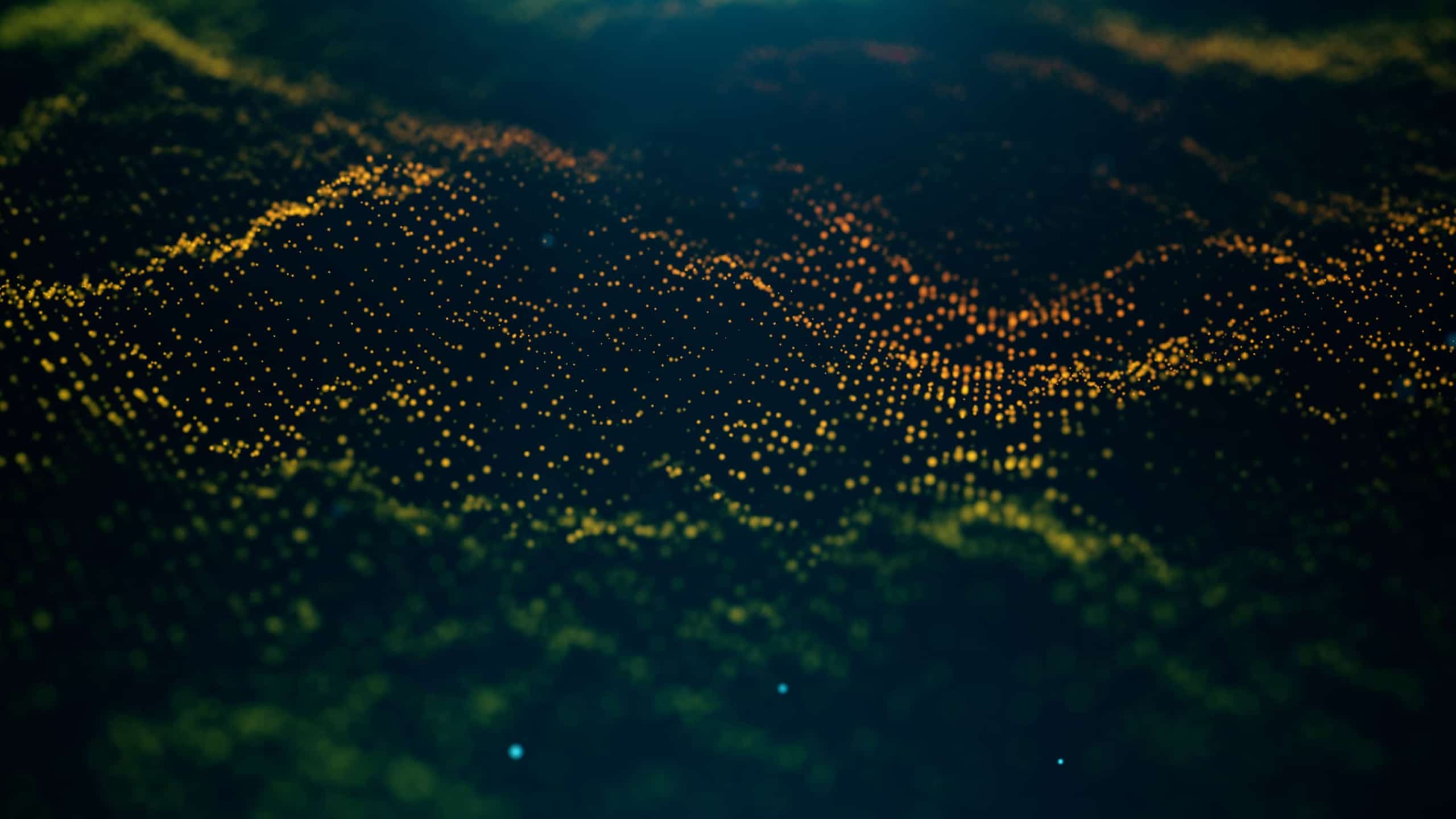 A digital representation of a landscape at night highlighted by numerous glowing yellow and orange dots, creating a wave-like pattern of illuminated terrain.