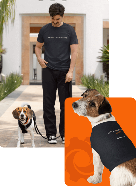 Dog and man wearing DomainTools merchandise: the man's merch has text "Let's go threat hunting" and the dog merch has text "Let's go treat hunting"
